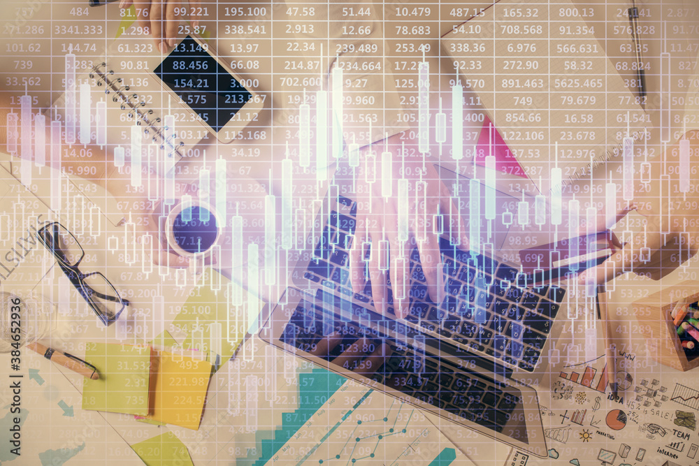 Multi exposure of man's hands typing over computer keyboard and forex graph hologram drawing. Top view. Financial markets concept. Multi exposure of man's hands typing over computer keyboard and forex graph hologram drawing. Top view. Financial markets concept.