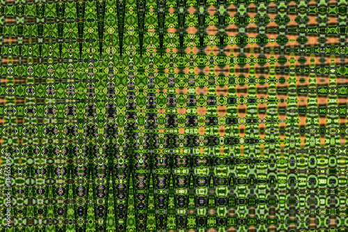 Abstract zigzag pattern with waves in green and orange tones. Artistic image processing created by floral photo. Beautiful multicolor pattern for any design. Background image