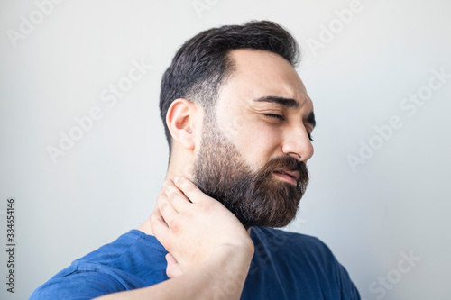 Young man with neck pain 