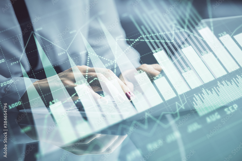 Double exposure of businesswoman hands typing on computer and forex chart hologram drawing. Financial analysis concept. Double exposure of businesswoman hands typing on computer and forex chart hologram drawing. Financial analysis concept.