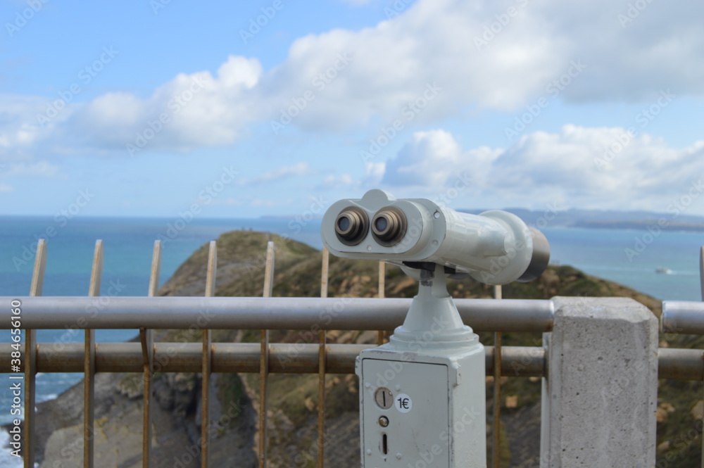Coin operated binoculars on the beach for tourists