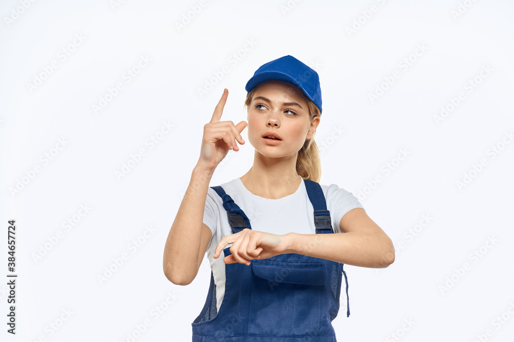 Working woman in blue cap uniform lifestyle emotions service light background Working woman in blue cap uniform lifestyle emotions service light background