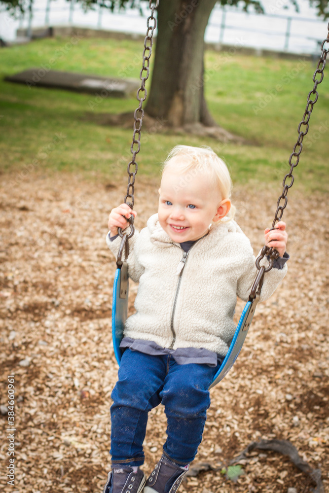 baby smiling on swing