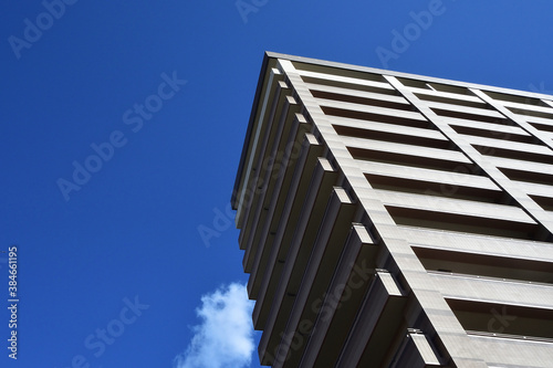 Tall apartment in blue sky