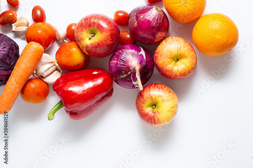 Top view various colorful vegetables and fruits isolated on white background, creative flat layout.
