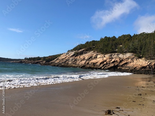 Waves on the beach with mountains Acadia National Park