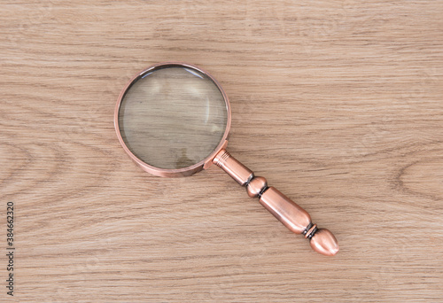An ordinary magnifying glass on the table