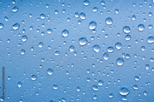 Water drops on a shiny metal surface