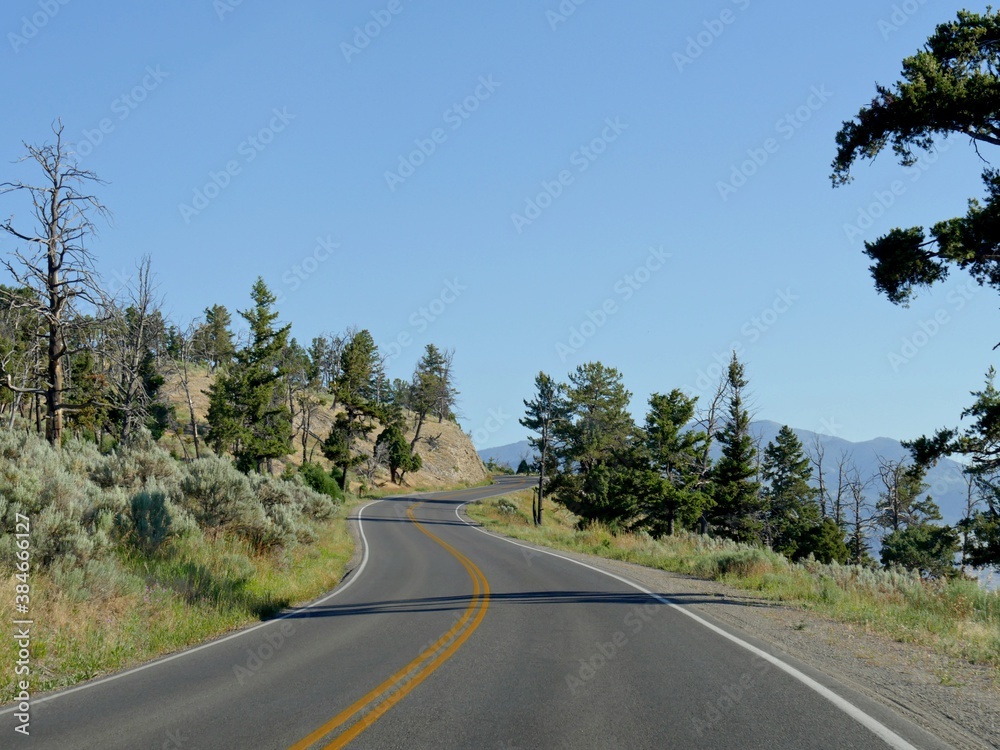Scenic upward road at Yellowstone National Park, Wyoming. Scenic upward road at Yellowstone National Park, Wyoming.