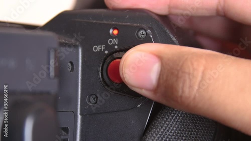 Close up of on and off switch on camcorder