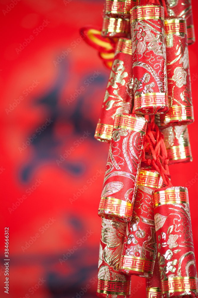 A string of red firecrackers in front of a red background