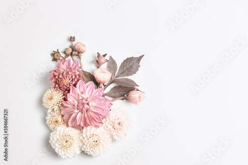 flower arrangement in vintage tinted. large Dahlia flowers on a light background. holiday layout, space for text, top view