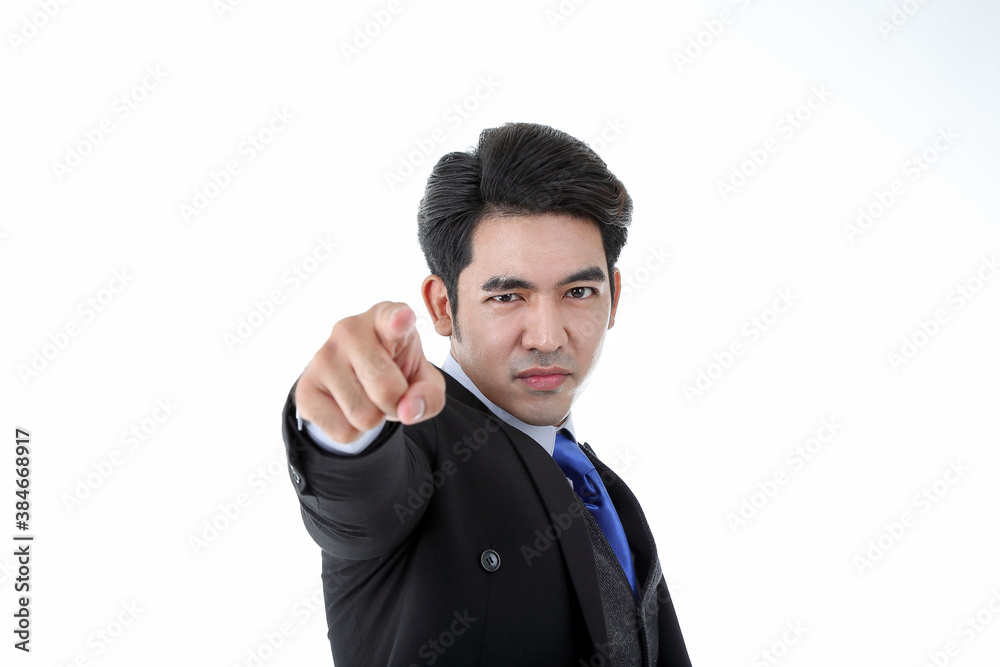 Southeast Asian young office business man wearing suit finger pointed want you expression look at camera on white studio background Southeast Asian young office business man wearing suit finger pointed want you expression look at camera on white studio background