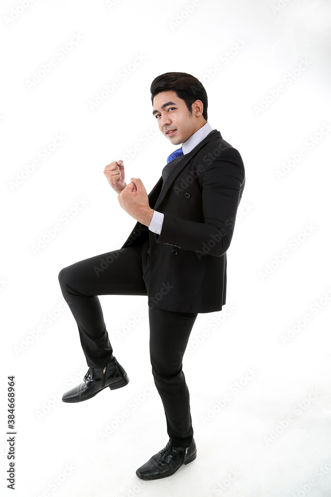 Southeast Asian young office business man wearing suit fist dance successful happy expression look at camera on white studio background Southeast Asian young office business man wearing suit fist dance successful happy expression look at camera on white studio background