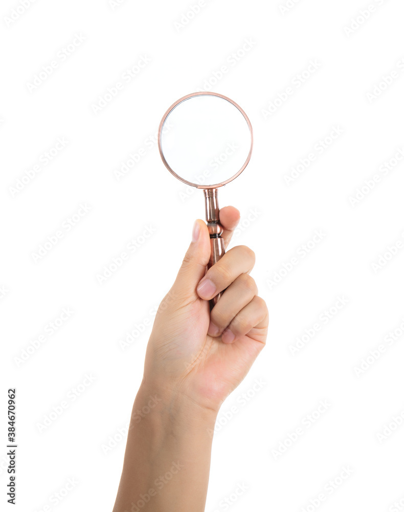 Hand holding a magnifying glass on white background Hand holding a magnifying glass on white background
