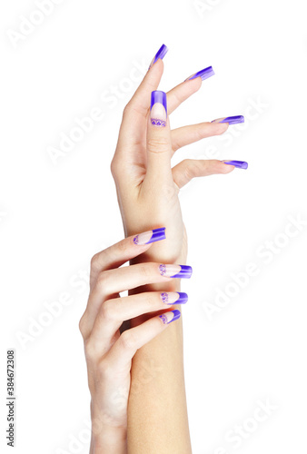 Canvas-taulu Hands with blue french acrylic nails manicure and painting