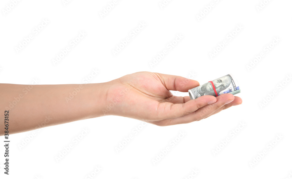 A hand holding a dollar bill in front of a white background makes a gesture of giving A hand holding a dollar bill in front of a white background makes a gesture of giving