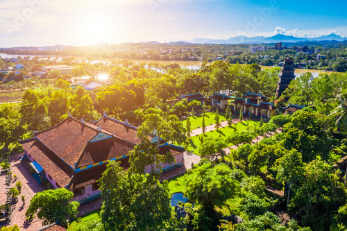 Aerial view of The Thien Mu Pagoda. It is one of the ancient pagoda in Hue city. It is located on the banks of the Perfume River in Vietnam's historic city of Hue. © CravenA