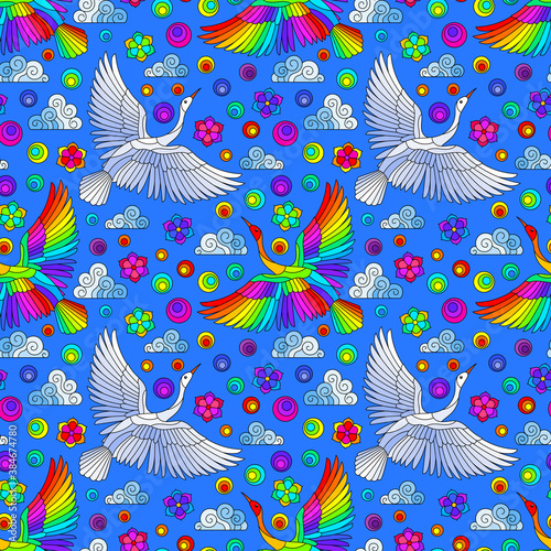 Seamless pattern with bright birds, clouds and flowers, bright birds on a blue background