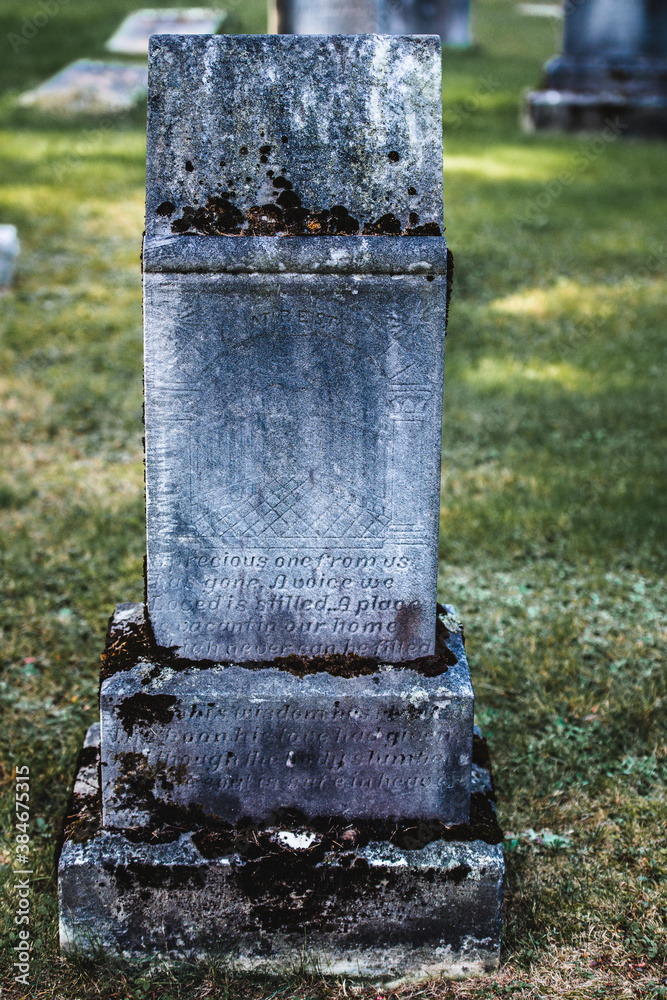 Old stone tombstone in a cemetery