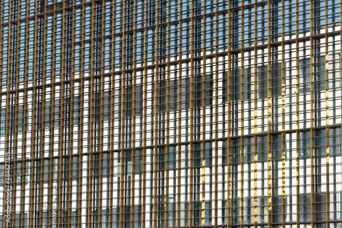 Glass facade with metal structure on a sunny day