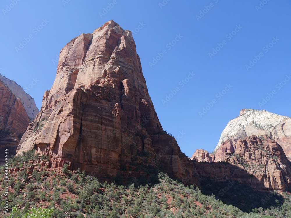 Massive sandstone cliffs and rock formations attract visitors to Zion National Park, Utah's first national park.