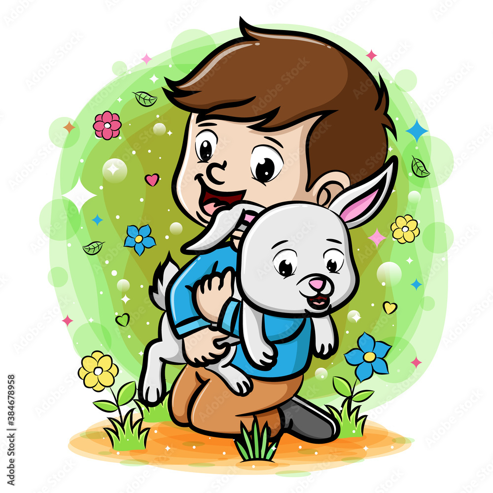 A boy playing with rabbit in the garden A boy playing with rabbit in the garden