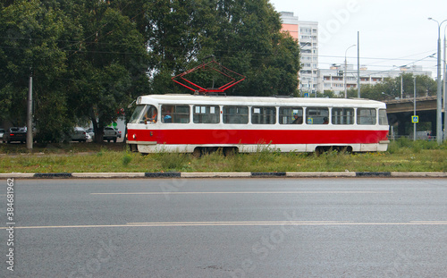 the tram is moving on a suburban route