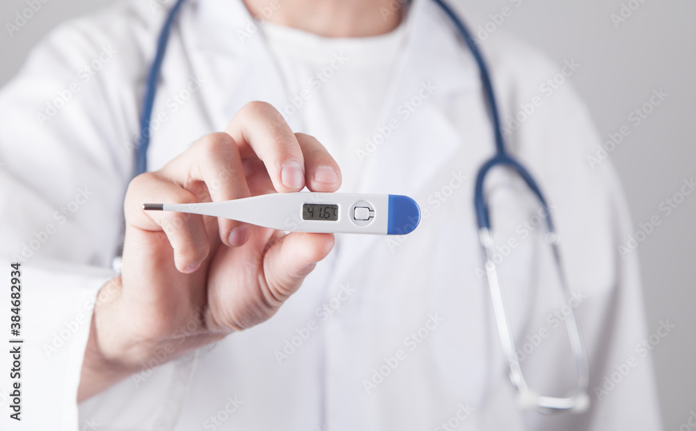 Caucasian doctor holding thermometer. Temperature Caucasian doctor holding thermometer. Temperature