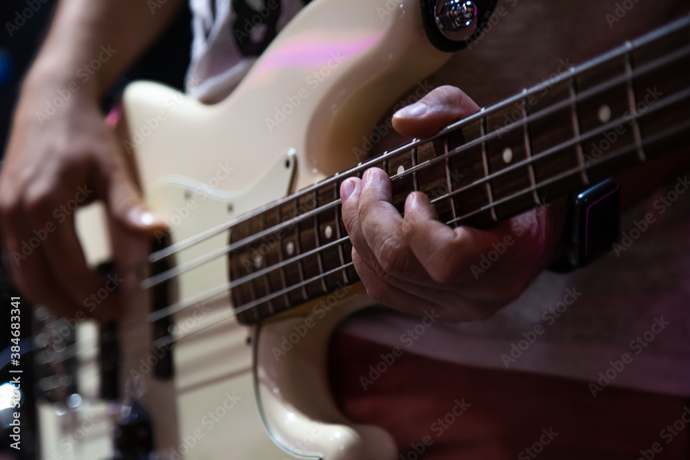 Process of playing the electric guitar close-up.