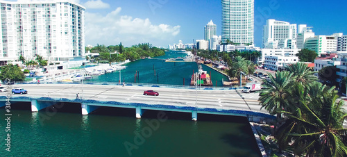 Miami Beach aerial view, Florida from drone viewpoint. Indian Creek and city skyline on a wonderful sunny day, slow motion.
