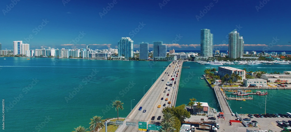 Fototapeta premium Miami, Florida. Aerial view of MacArthur Causeway and surrounding skyline from drone on a sunny day.