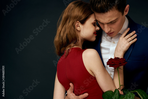 Beautiful couple charm hug lifestyle relationship rose luxury dark background