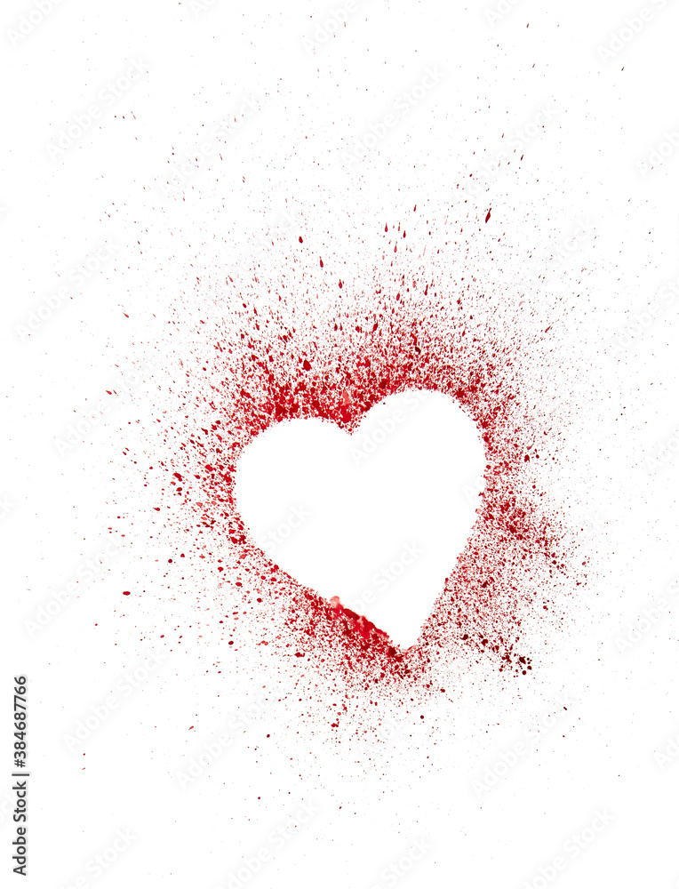 human heart and splashed red blood stains around it on a white background