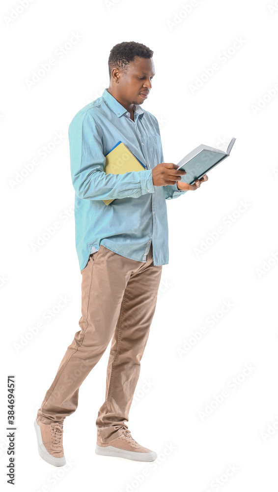 African-American man with books on white background African-American man with books on white background