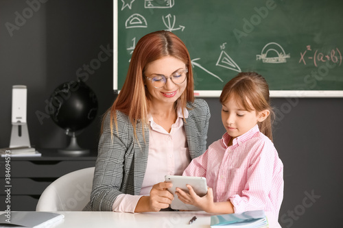 Teacher with little schoolg...