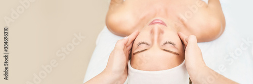 Beautiful portrait on white background. Cosmetology massage. Young woman facial medical treatment. Skin care concept. Nature people. Beauty spa salon. Face mask procedure. Healthcare rejuvenation