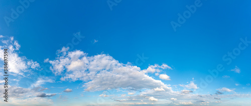 Fantastic clouds against blue sky, panorama