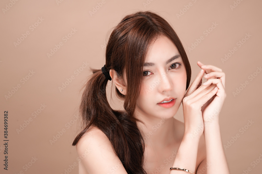 Asian beauty woman with natural makeup, cosmetic and plastic surgery concept, Isolated mocha brown background Asian beauty woman with natural makeup, cosmetic and plastic surgery concept, Isolated mocha brown background