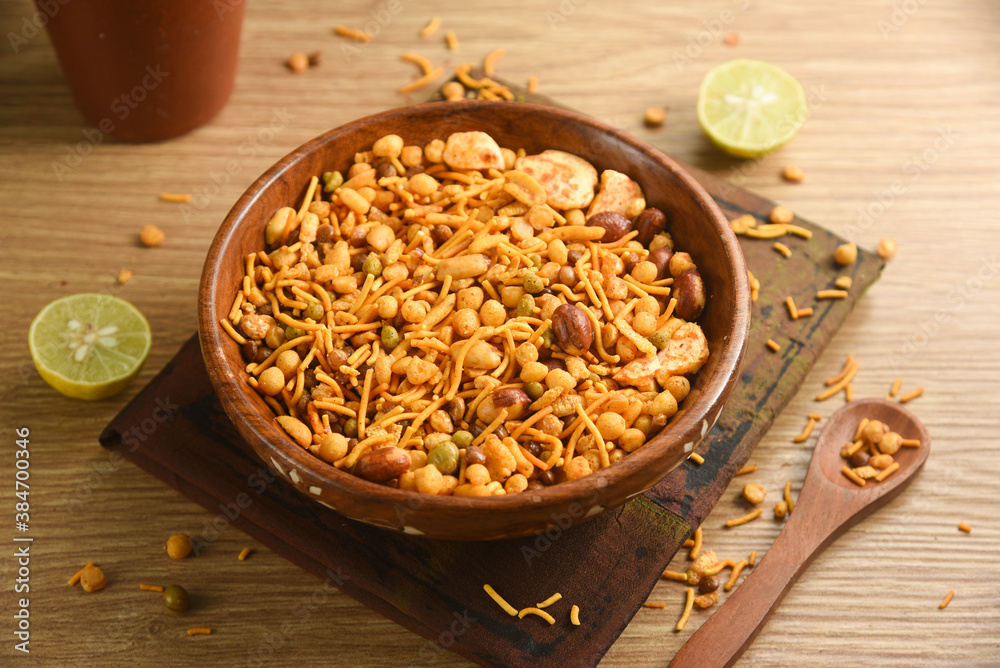 Ταπετσαρία Traditional indian deep fried salty dish - chivda or mixture or farsan or namkeen made of gram flour and mixed with dry fruits