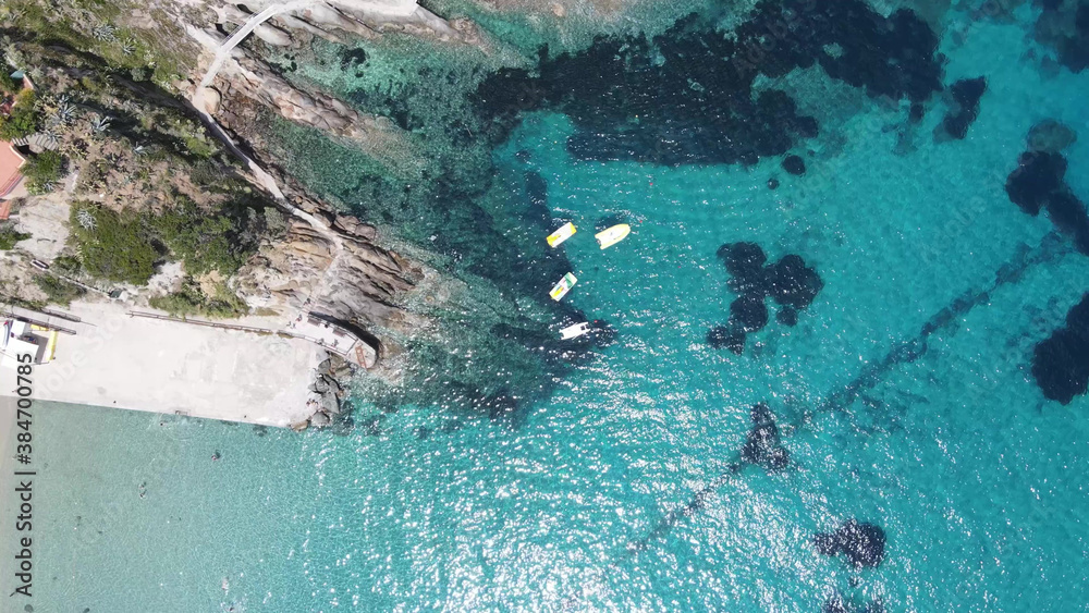 Colourful Pedal Boat on the shoreline. Overhead aerial view from drone. Time Lapse.