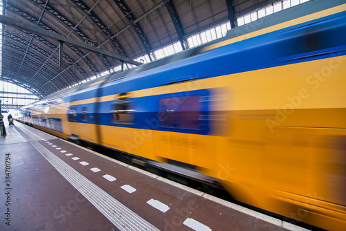 Photography Train speeding up in Amsterdam Central Station