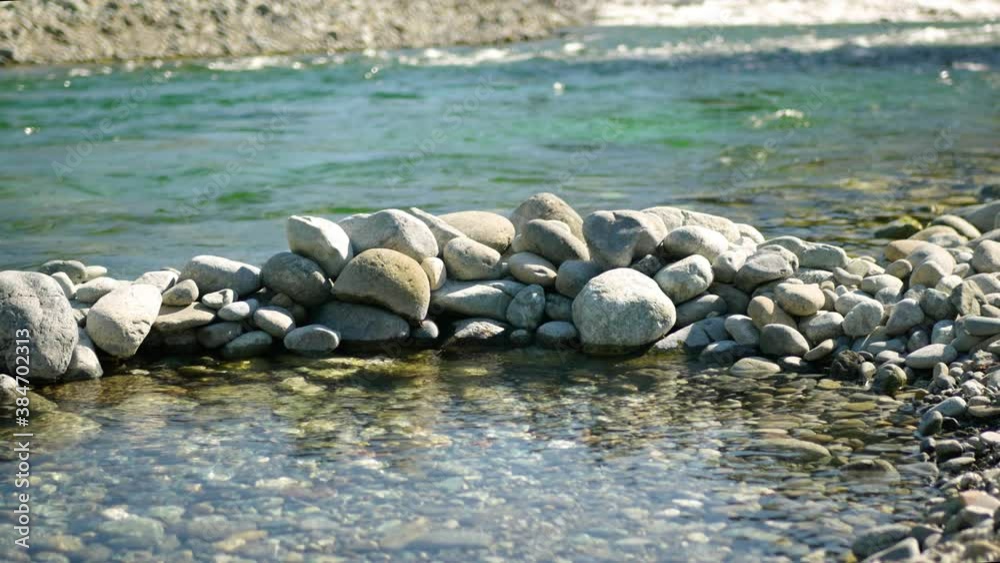 Rock Pool Walled with large stones protects from exterior ocean waves behind, high frame rate / Slow Motion Rock Pool Walled with large stones protects from exterior ocean waves behind, high frame rate / Slow Motion