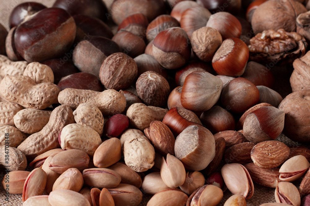 assortment of nuts, walnuts, hazelnuts, peanuts, almonds, chestnut pistachios assortment of nuts, walnuts, hazelnuts, peanuts, almonds, chestnut pistachios