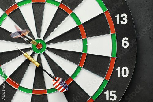 Darts. The dart for playing in the game board is stuck. Hit the sector in darts. The concept of a successful strategy.