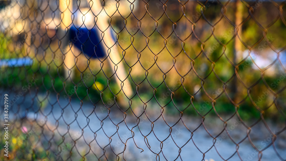 Metal fence with selective focus and shallow depth of field. Metal fence with selective focus and shallow depth of field.