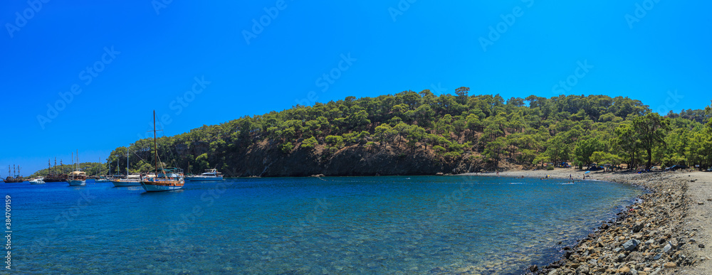 Beautiful sea bay with pleasure yachts on a summer sunny day. Beautiful sea bay with pleasure yachts on a summer sunny day.