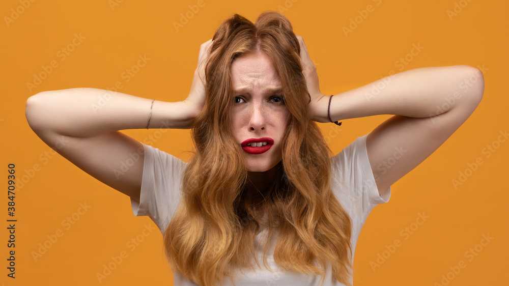 Stress and mental health. Beautiful young woman in distress looking worried and desperate Stress and mental health. Beautiful young woman in distress looking worried and desperate