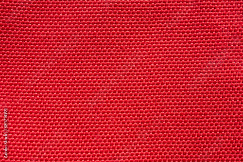 Red fabric cloth texture background close up