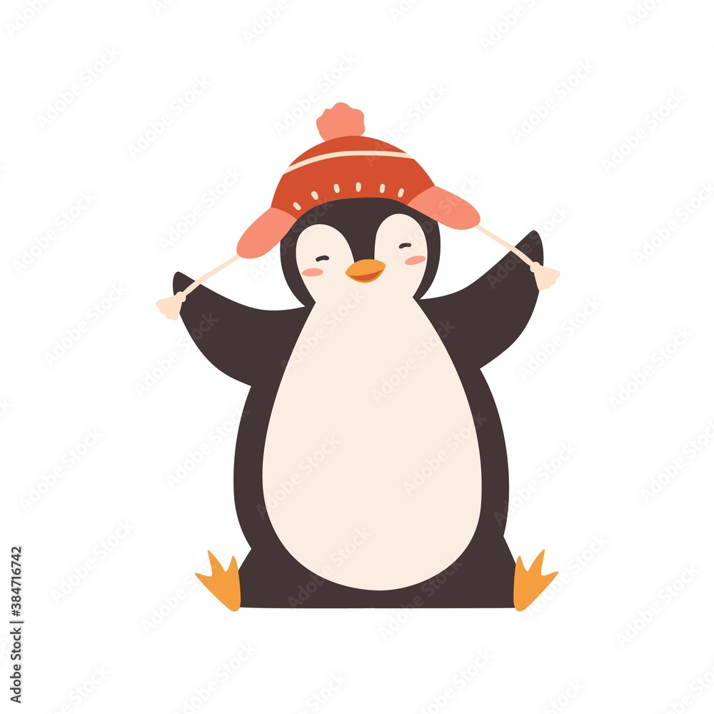 Fototapeta premium Funny baby penguin enjoying winter season vector flat illustration. Happy polar bird wearing chullo hat with pompom isolated on white. Adorable childish animal character in warm headwear